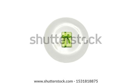 Black Friday concept photo. Present box on white plate isolated. Sale and discount. Christmas shopping ideas. Special offer.