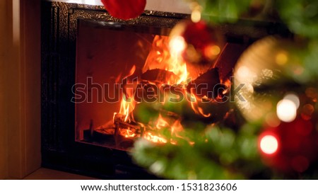 Christmas background of fireplace and decorated Xmas tree at house