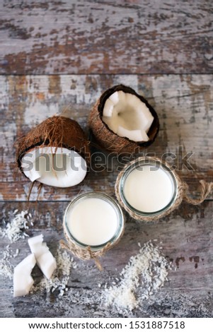 Keto diet. Keto drinks. Jars of coconut milk, coconut flakes, coconut. Coconut milk extraction. Vegan milk. Selective focus. Macro.