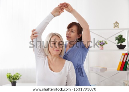 Picture of middle aged woman during rehabilitation in professional clinic. Closeup