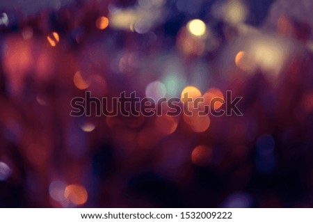 Abstract christmas lights as dark red and purple background