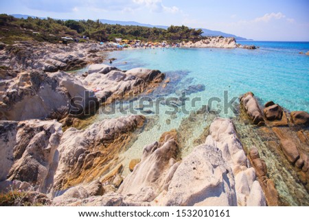 Rocky beach landscape on a summer day, Beautiful turquoise color seawater, Travel holiday destination Greece