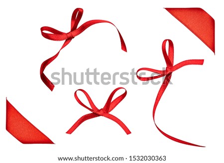 close up of a  red ribbon bow on white background