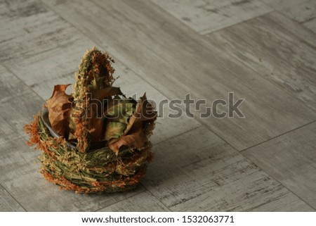 collected dry leaves in a basket