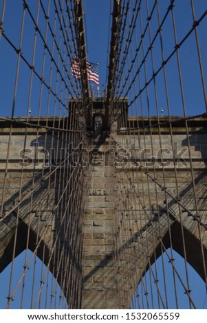 A close up of the Brooklyn Bridge. Including the year of 1875.