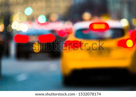 Abstract blurred background of evening city.Night traffic,colorful lights