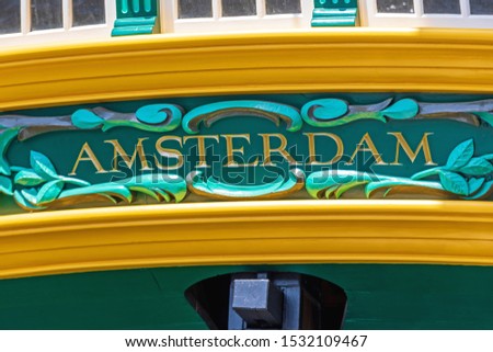 Golden Amsterdam Letters at Old Wooden Tall Ship