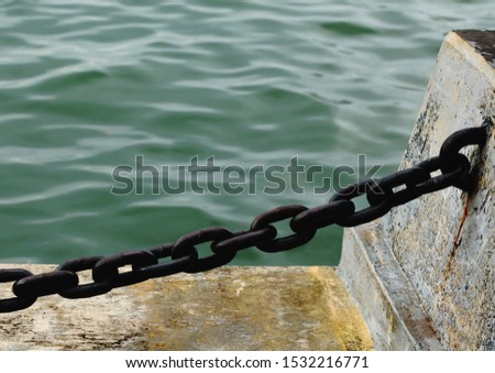 Abstract Minimalist Photography,Big iron chain and sea water as background