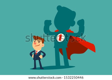 Confident businessman standing in front of his shadow wearing red cape as a superhero. Business ambition concept. Royalty-Free Stock Photo #1532250446