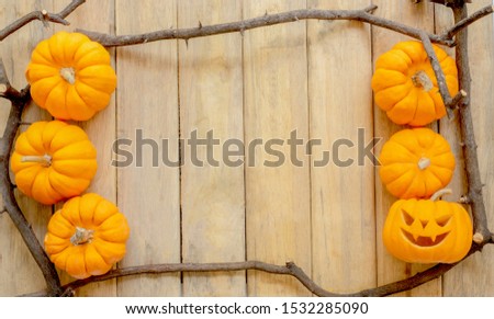 pumpkin background Halloween tree branch framework of scary jack lantern on vintage wooden wall texture for October Halloween festival and thanksgiving concept design with copy space