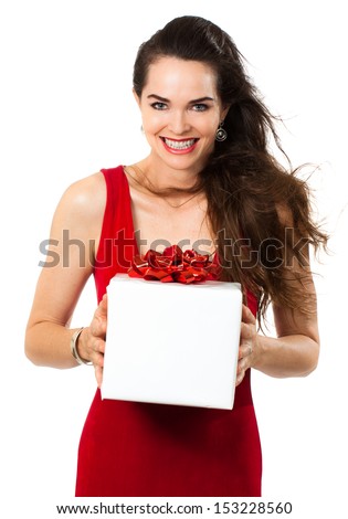 A beautiful happy woman holding a gift. Isolated on white.