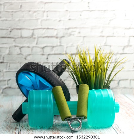 Fitness Equipment on Wooden Background. Shallow depth of field