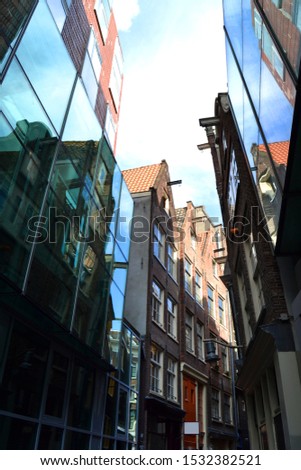 The street in Amsterdam with old and modern architecture, The Netherlands. Vertical view
