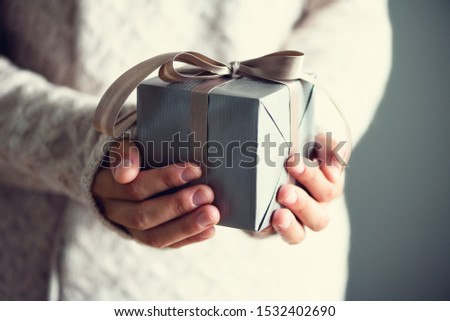Female hands opening gift box, copy space. Christmas, hew year, birthday concept