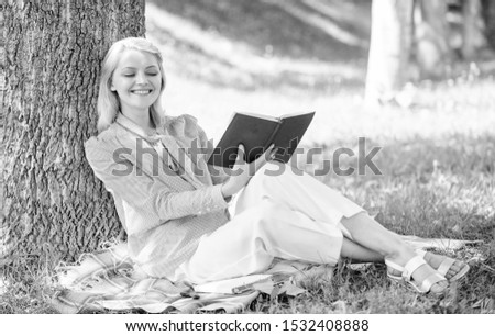 Business lady find minute to read book improve her knowledge. Self improvement and education concept. Female self improvement. Girl lean on tree while relax in park sit grass. Self improvement book.