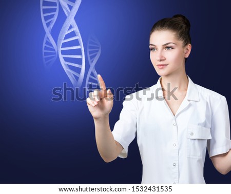 Woman science technologist touches DNA stems. Over dark blue background.