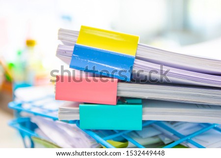 file folder and Stack of business report paper file on the table in a work office, concept document in work office