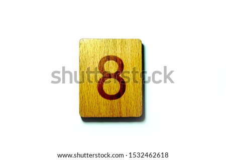  Wooden block number 8 on a white background                              