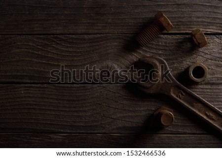 Different workpieces on a wooden background. Hedge wrenches keys, hammer
