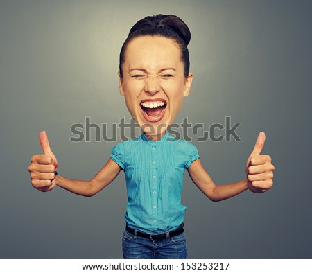 happy screaming girl with big head and big thumbs up Royalty-Free Stock Photo #153253217