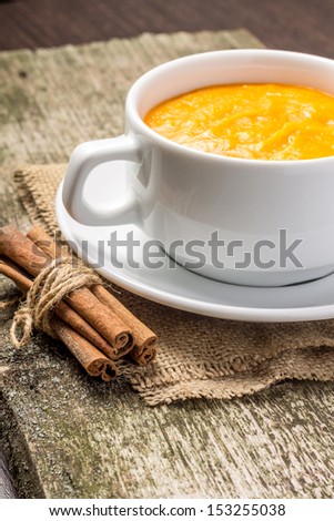 Sweet pumpkin porridge at old wood plank