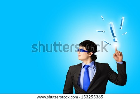Image of young businessman with exclamation mark