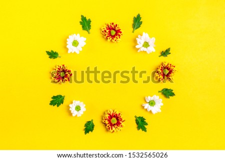 pattern of round frame of flowers white, red asters, green leaves  isolated on yellow background Flat lay Top view Mock up Sesonal concept Hello autumn, spring or summer, Good morning Holiday card