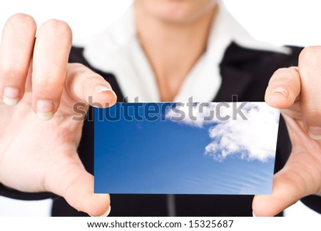 Business woman holding card with sky and clouds