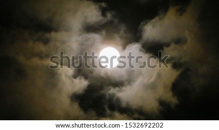 Beautiful of Full moon shining and cloudy and dark night sky