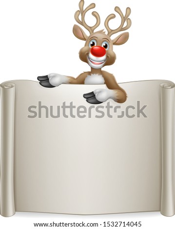 Christmas reindeer cartoon character peeking over a scroll sign and pointing at it