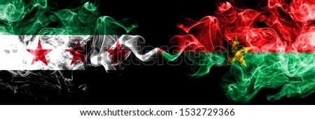 Syrian Arab Republic vs Burkina Faso smoke flags placed side by side. Thick colored silky smoke flags of Syria opposition and Burkina Faso