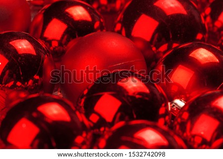 Beautiful Christmas background with red shiny baubles, copy space