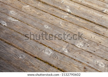 Old wooden outdoor flooring background photo with selective focus