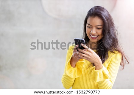 Woman with smartphone in downtown city street
 Royalty-Free Stock Photo #1532790779