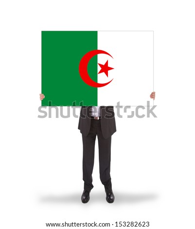 Businessman holding a big card, flag of Algeria, isolated on white