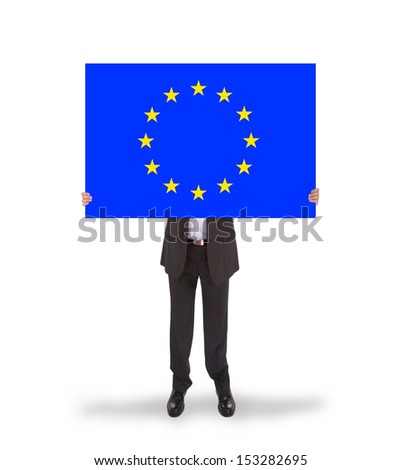 Smiling businessman holding a big card, flag of the European Union, isolated on white