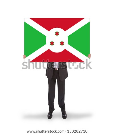 Businessman holding a big card, flag of Burundi, isolated on white
