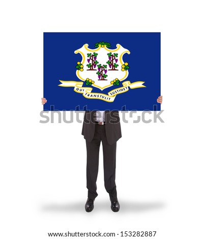 Smiling businessman holding a big card, flag of Connecticut, isolated on white