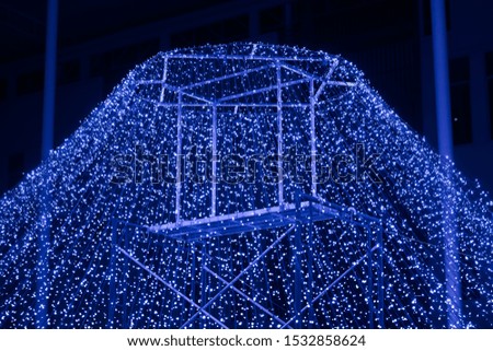 Amazing light festival at night. Led lights made up a mountain in blue.
