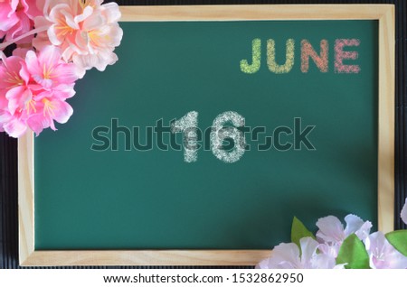 ๋ีืJune month write with colorful chalk, flowers on the board, Date 16.