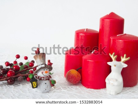 Christmas figurines and candles red