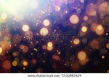 Abstract Golden glare on abstract bokeh background