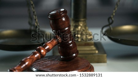 Wooden judge`s gavel. The criminal law. Low concept