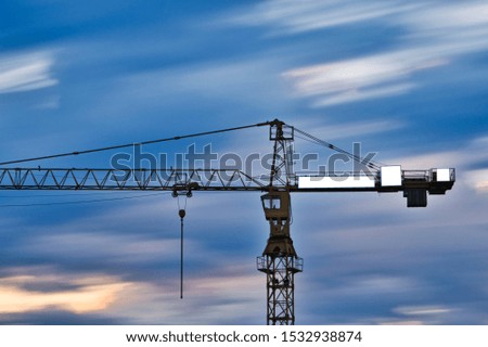 Long exposure mock up of multiple small advertisement banners on a crane