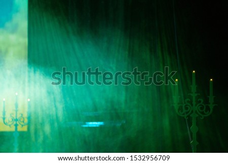 Theater stage, colored puffs of smoke in stage light. Texture blur, background for design.