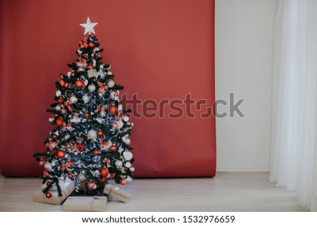 Christmas tree with presents on a red burgundy background