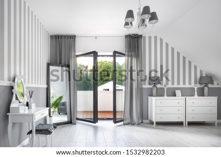 Romantic style gray room with white dressing table and chest of drawers Royalty-Free Stock Photo #1532982203