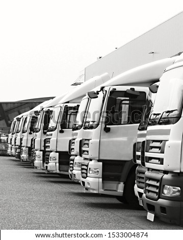 lorries parked up outside a company's car parking area no people stock photo Royalty-Free Stock Photo #1533004874