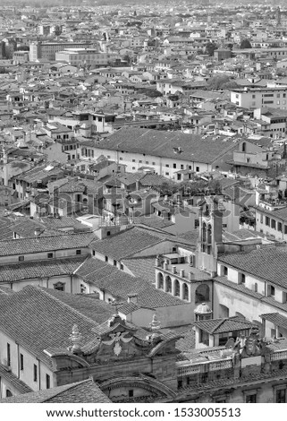 Aerial view. Tile roofs of Italian buildings in the old city. Urban landscape. Black and White Photography. Italy, Tuscany, Florence 