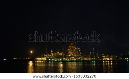 view of the night industry by the river